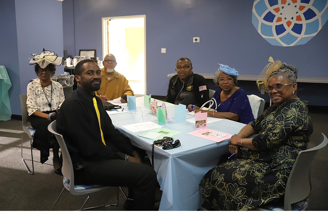 Perquimans County ladies seated together at a decorated table during a Smart Start event